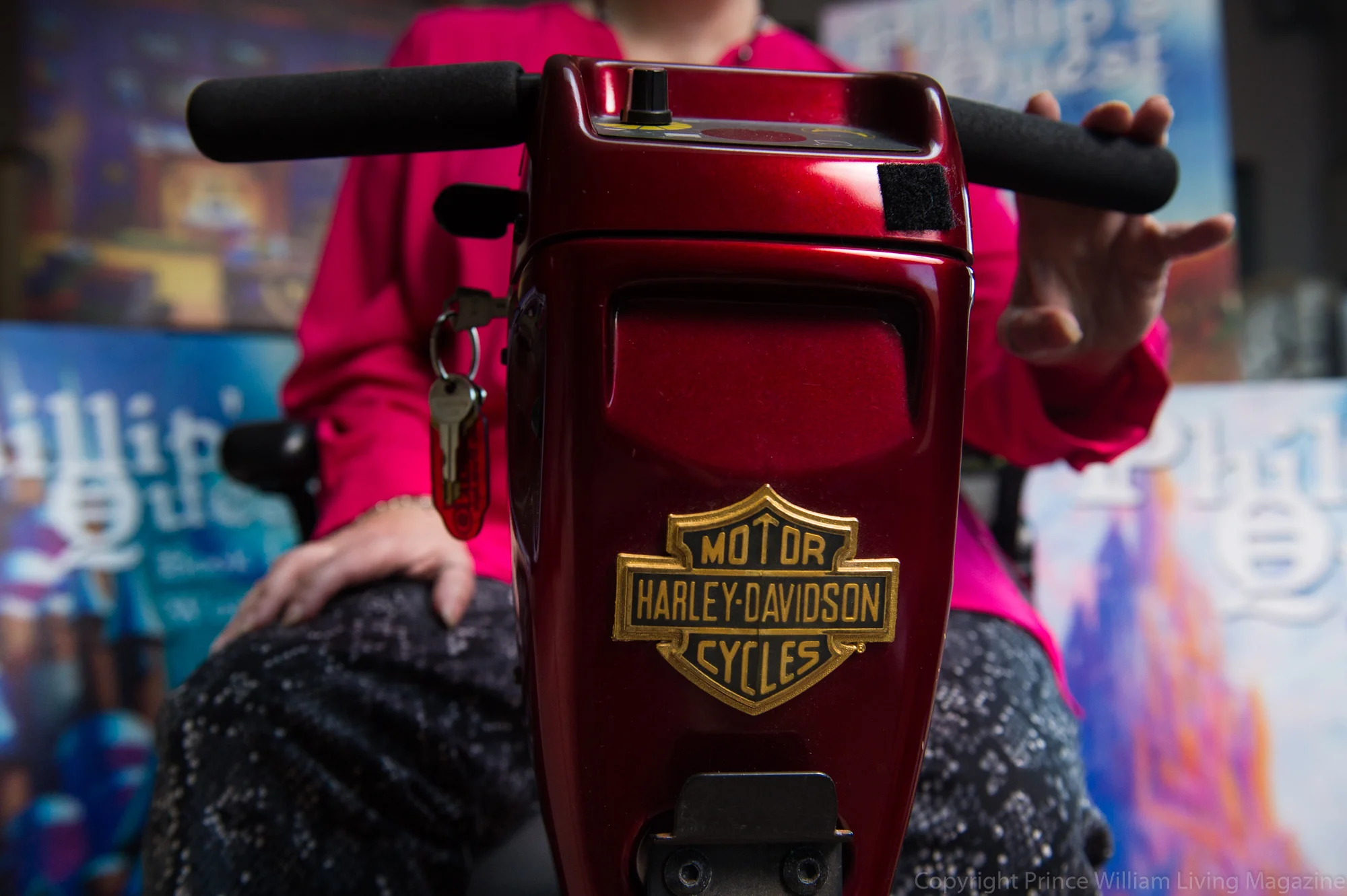  Belinda isn't afraid to laugh at herself and enjoy life to the fullest. Her scooter is decked out with a Harley-Davidson logo and complete with rear view mirrors! 