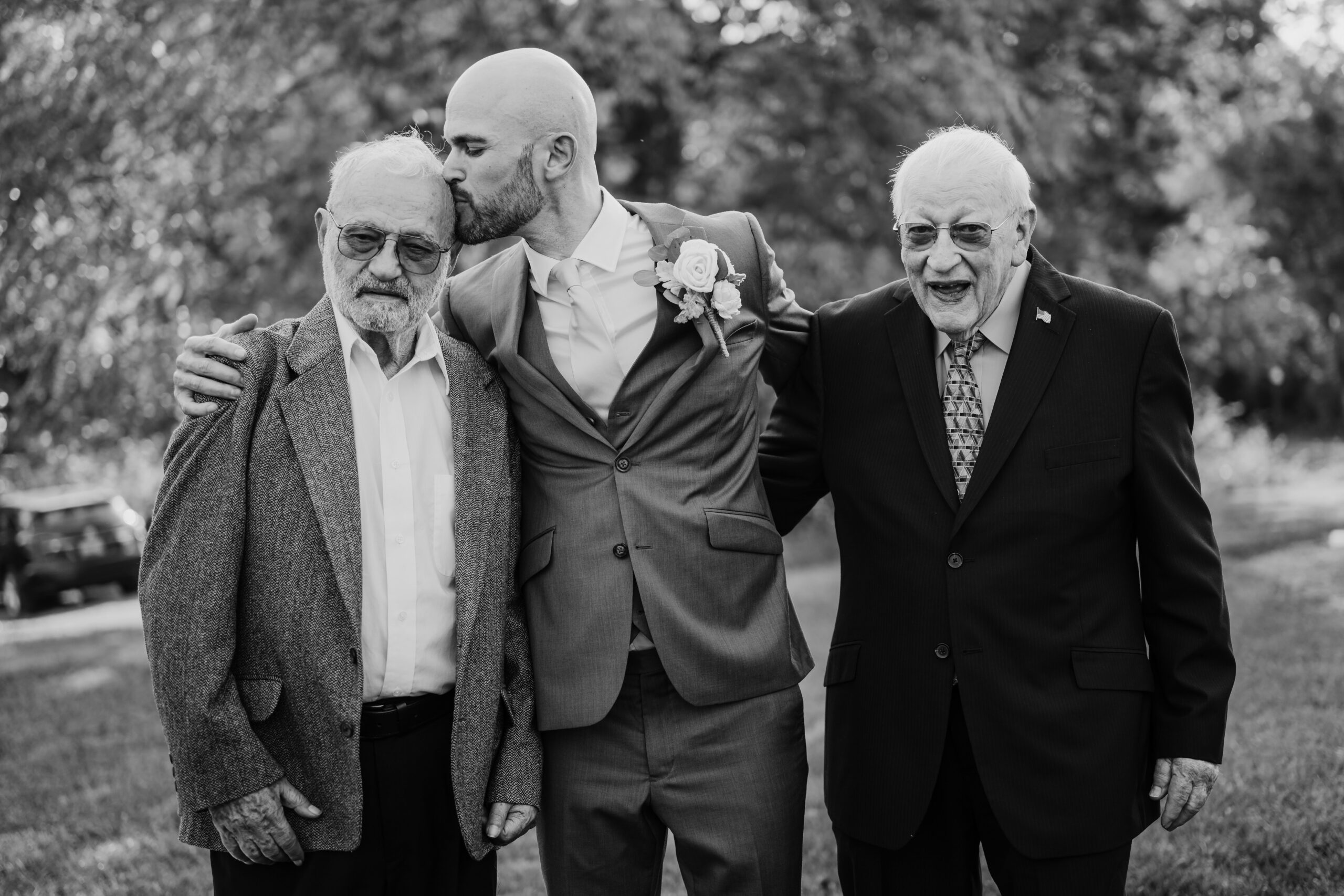 A groom with his two grandfathers